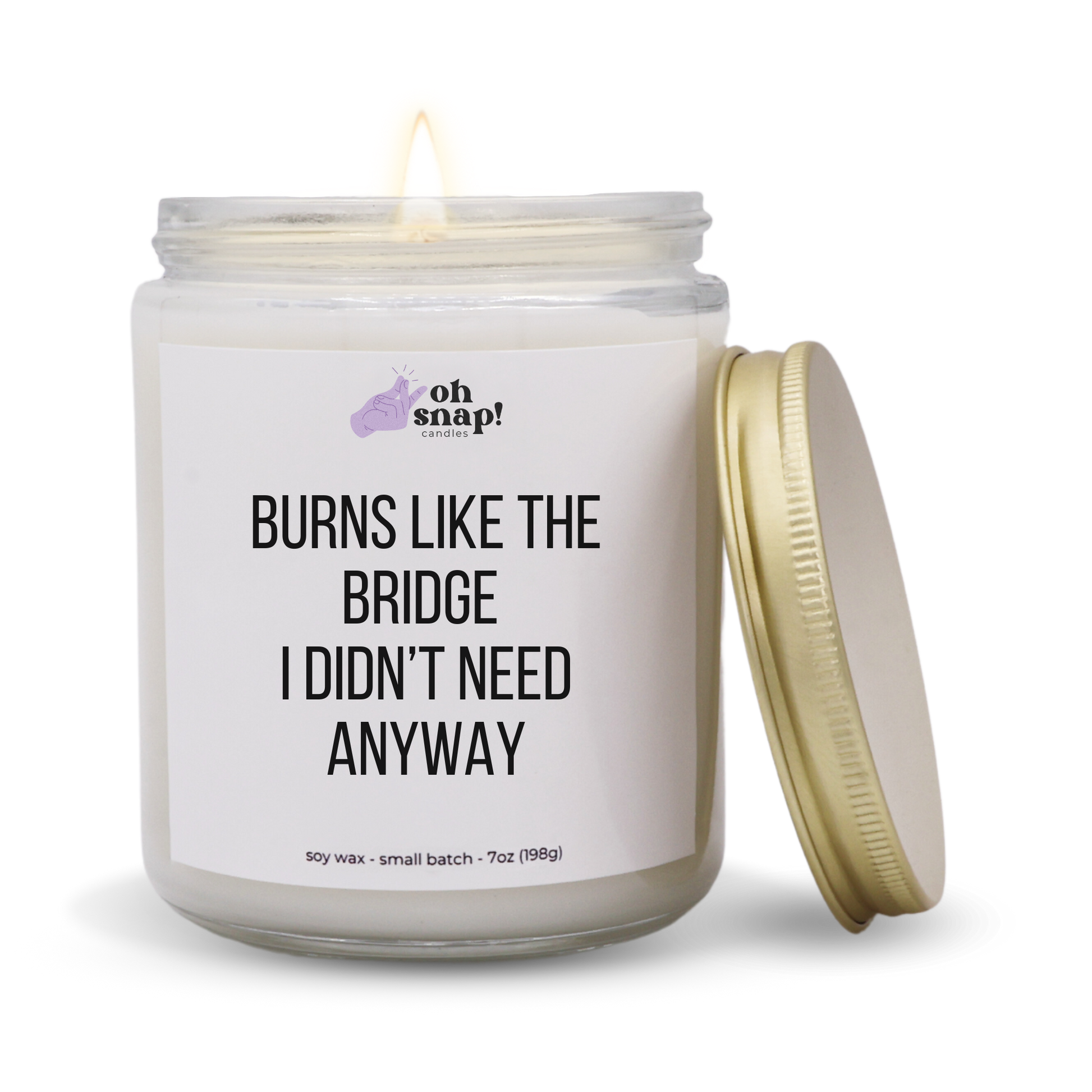 A candle with a label that says Burns Like The Bridge I Didn’t Need Anyways